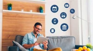 Man on tablet looking up information with admissions icons