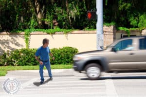 Jaywalking man about to be run over by a truck