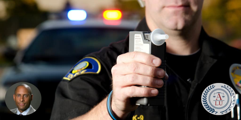 Police officer with breathalyzer